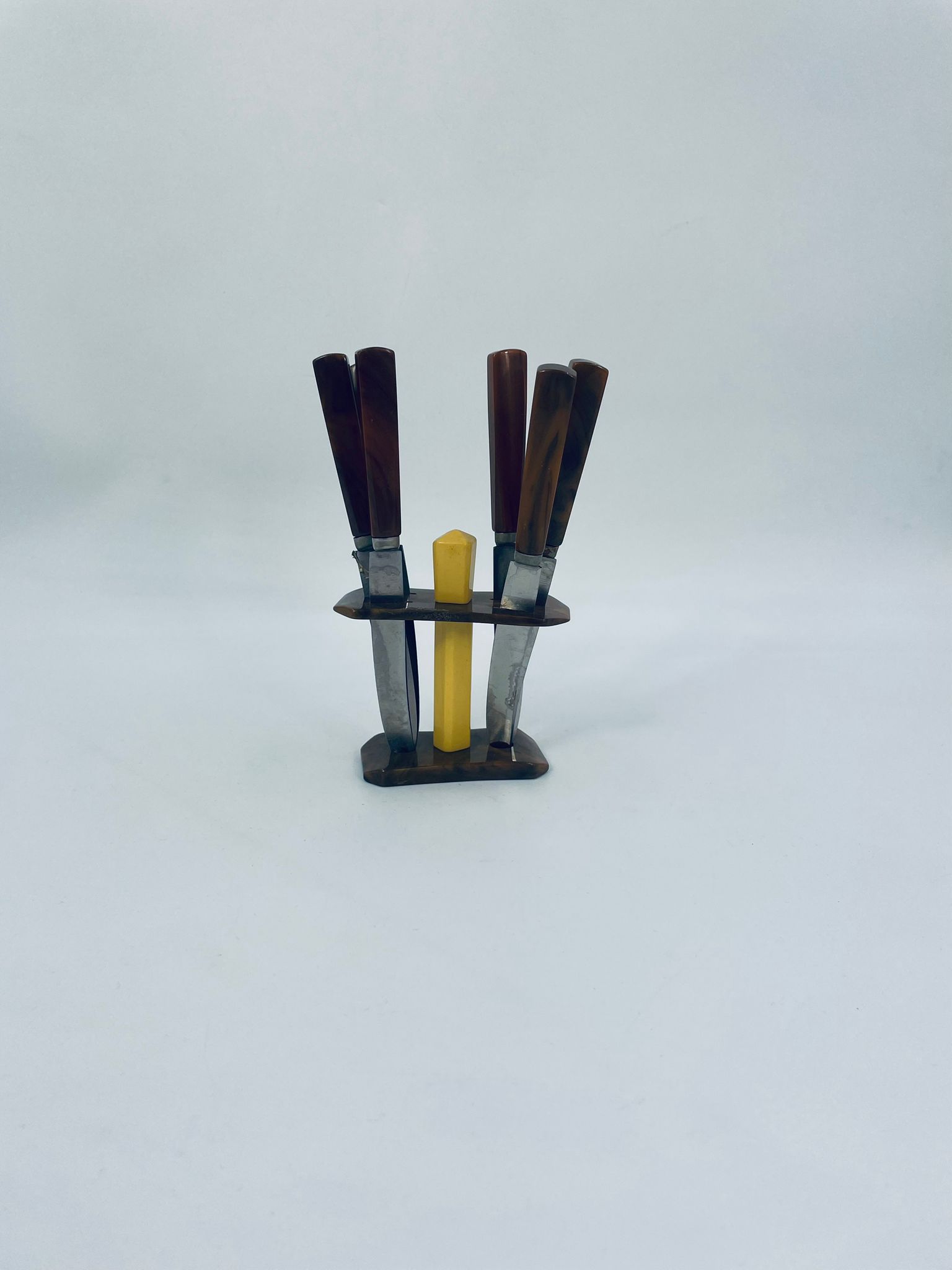 A set of antique fruit knives from the 1950s.