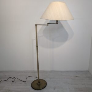Stylish brass floor lamp with adjustable arm