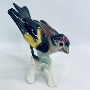 Old collector's figurine bird pinkie