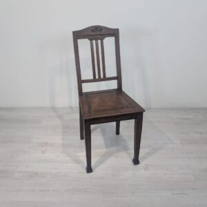 Antique old oak chair with natural leather