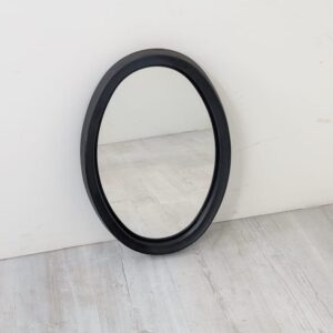 Mid 20th century wall mirror, oval with black plastic frame