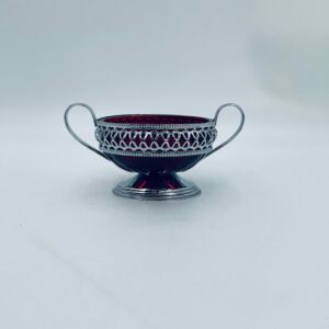 Vintage crystal sugar bowl in metal basket